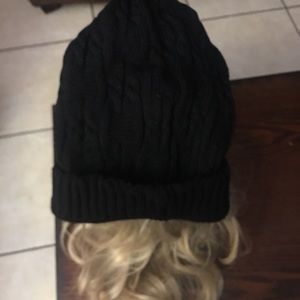 New, adult stocking hat with cable knit.